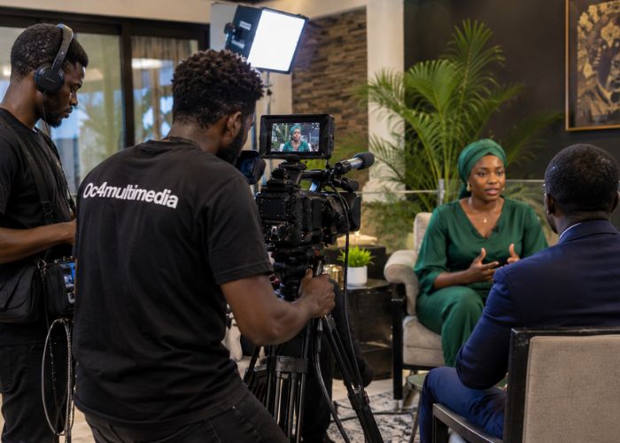 Film crew capturing an interview style scene