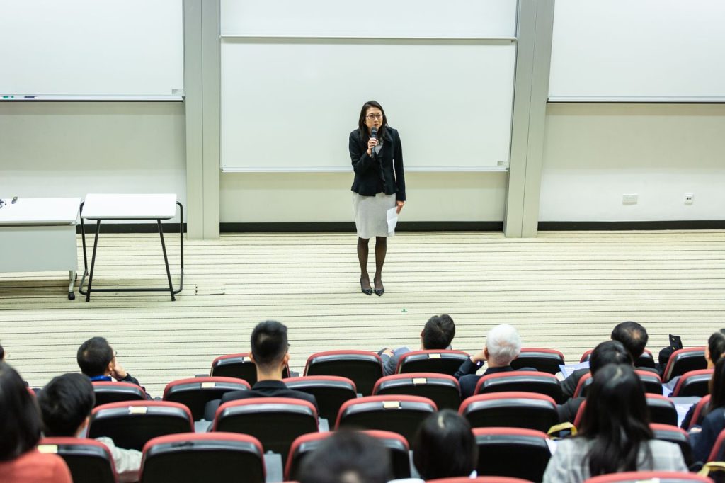 Speaker presenting on stage during a branded livestream production