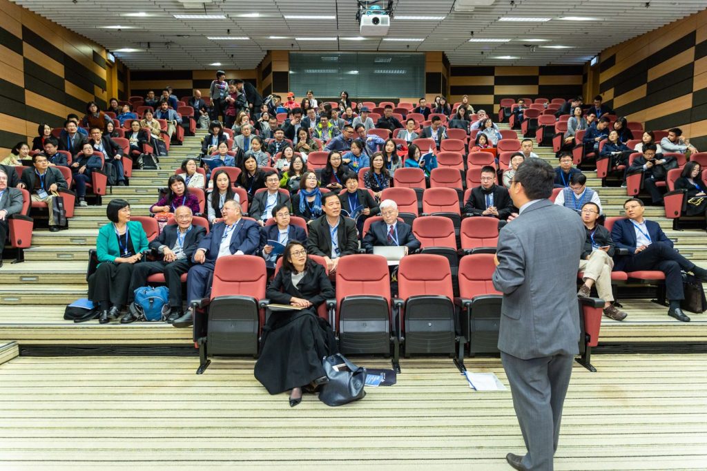 Professional conference audience watching a livestreamed presentation