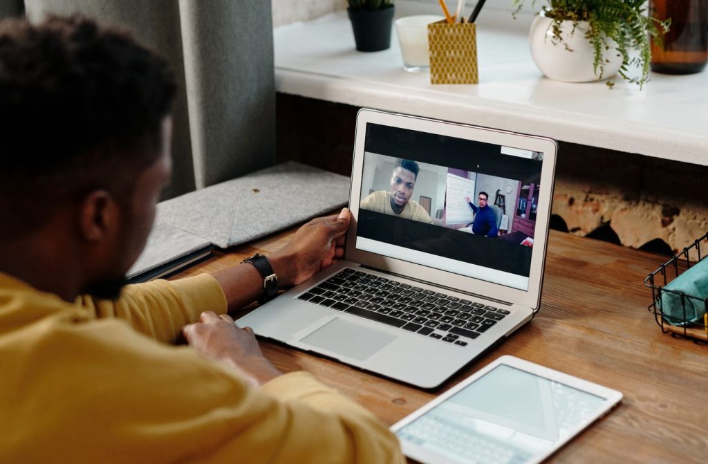 Presenter hosting a webinar and virtual event production from a laptop
