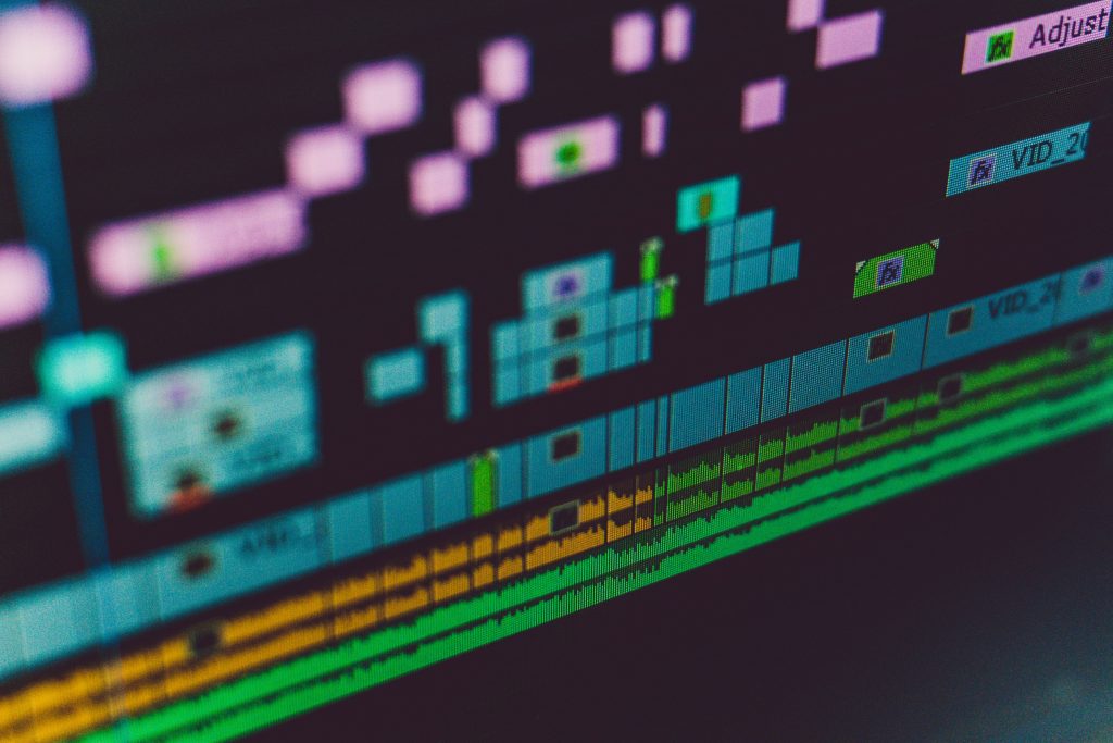 Colourful multi-track video editing timeline on a professional editing screen