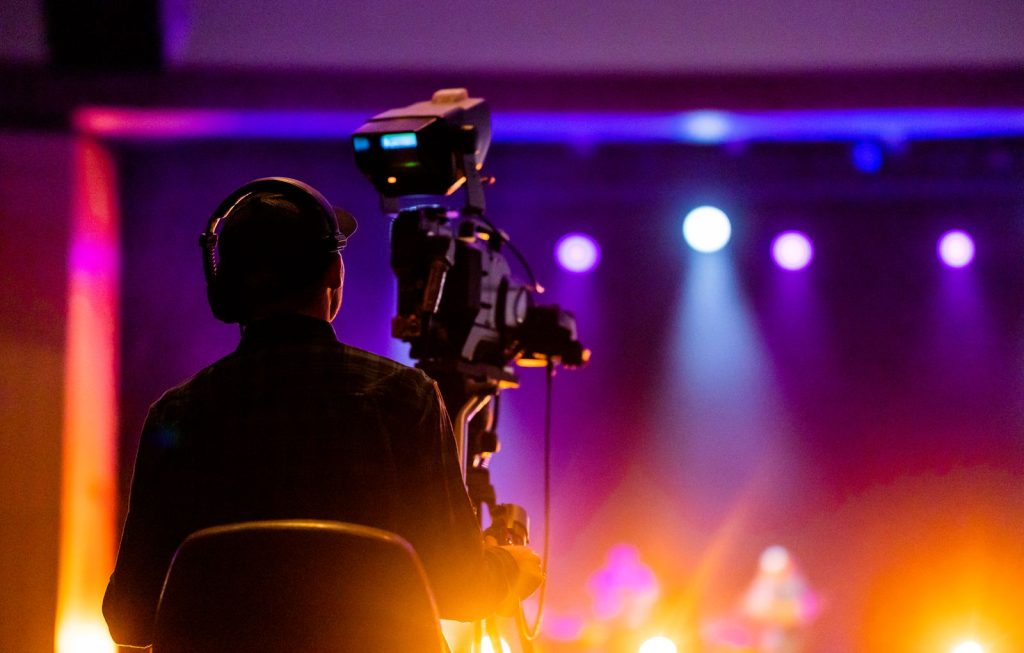 Camera operator recording a professional livestream at a live event