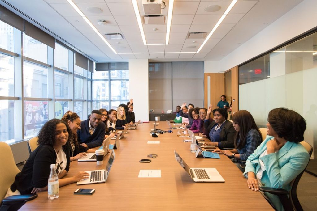 Diverse group of professionals collaborating around a conference table on a growth plan
